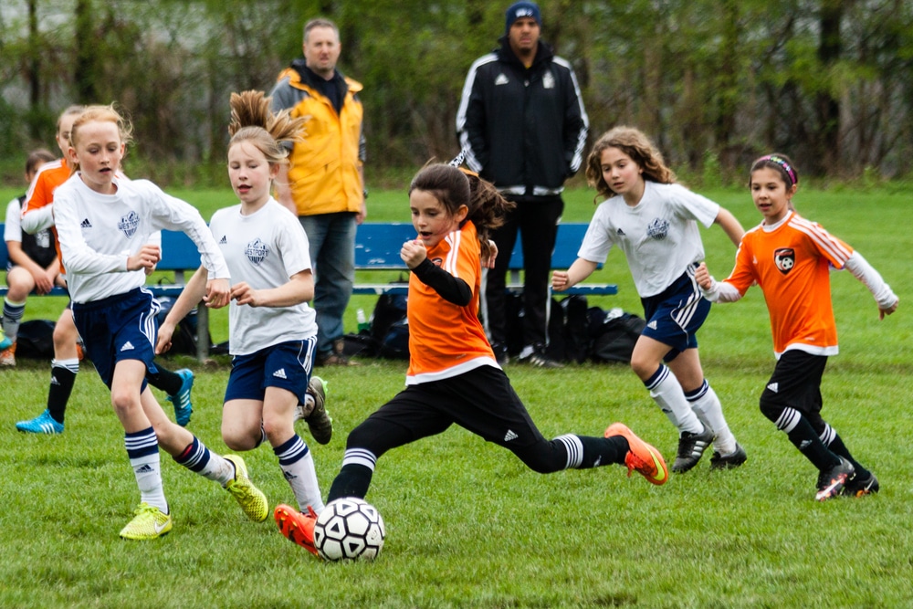 Westport, CT, USA - May 8, 2016: Daytime scene of young girls in an all girls team in Westport, Connecticut on May 8, 2016 while playing an organized youth soccer game